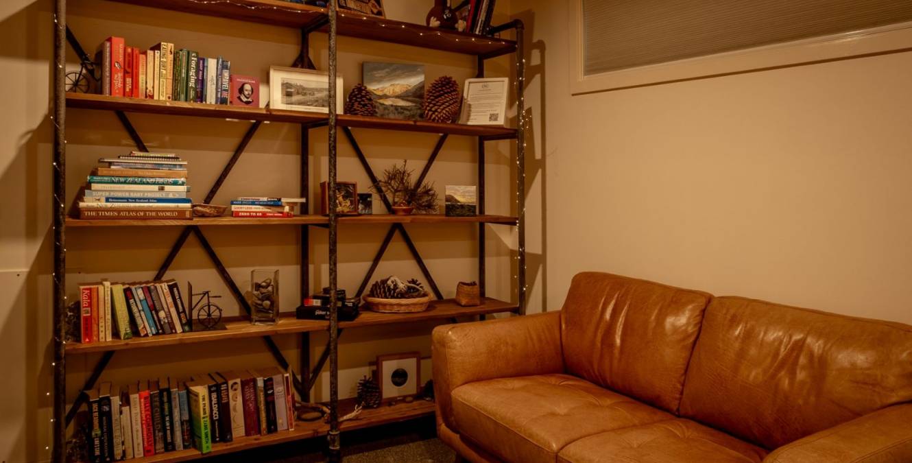Cosy library and reading area at Lakestone Lodge near Lake Pukaki