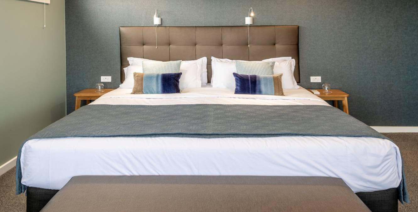 Californian king bed in the Lake View Spa Suite at Lakestone Lodge near Lake Pūkaki and Aoraki Mt Cook